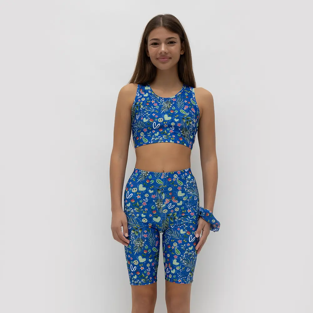 σε print BLUE. Άνετη εφαρμογή από ανακυκλώσιμο ύφασμα* που απομακρύνει τον ιδρώτα και τέλεια στήριξη κατά την διάρκεια της προπόνησης. Απαλό και άνετο στην κίνηση. Σημείωση: Το μοντέλο της φωτογραφίας είναι Μέγεθος: 12 *Ανακυκλώσιμο υλικό